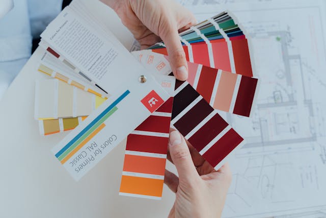Person holding paint swatches